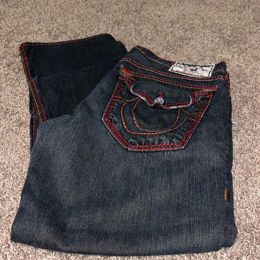 Men’s 36 True Religion “straight” double stitching. Trimmed in red & orange.